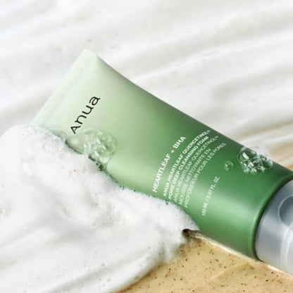 Anua Heartleaf Quercetin Pore Deep Cleansing Foam tube surrounded by rich white foam lather